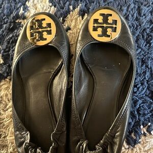 Tory Burch Black Flats with Gold Emblem